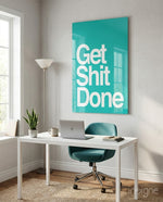 Get Shit Done glass wall art displayed above a desk in a home office