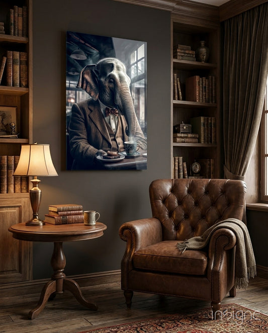 Retired Elephant glass wall art displayed above a chair in a library