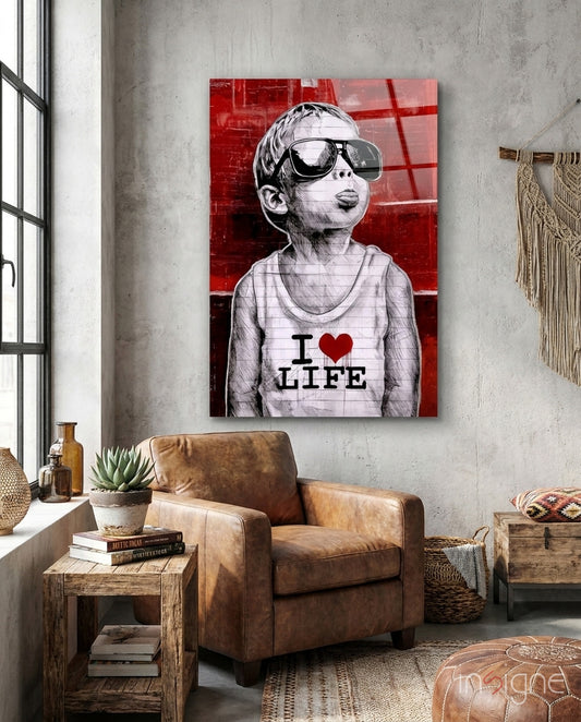 I Love Life glass wall art displayed above a chair in a loft