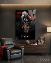 Jordan glass wall art displayed above a leather chair in a man cave