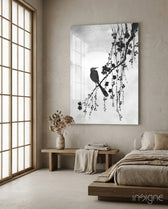 Bird on the Branch glass wall art displayed above a bench in a meditation corner