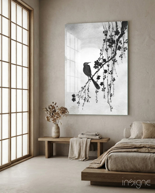 Bird on the Branch glass wall art displayed above a bench in a meditation corner