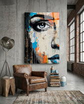 Half Portrait glass wall art displayed above a chair in a loft