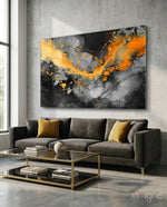 Marble glass wall art displayed above a sofa in a living room