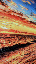Sunset over water with vibrant colors