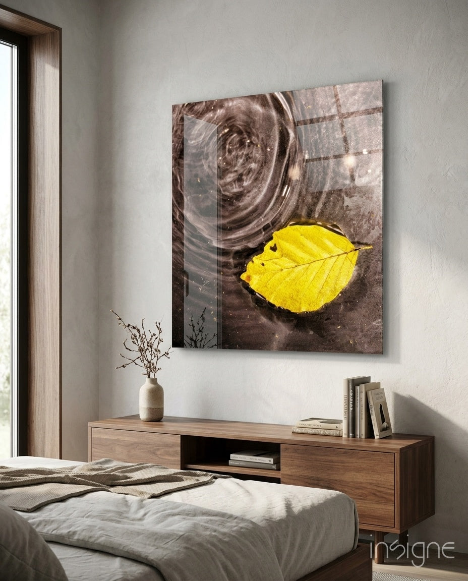 Yellow leaf on rippled water cinematic glass wall art over walnut console in designer wellness clinic