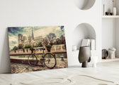 Bicycle glass wall art styled above a reading nook or library sofa