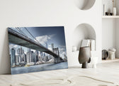 Manhattan Bridge glass wall art styled above a sofa in a modern loft