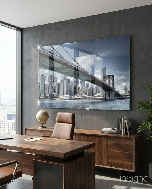 Manhattan Bridge glass wall art displayed above a console in a designer interior