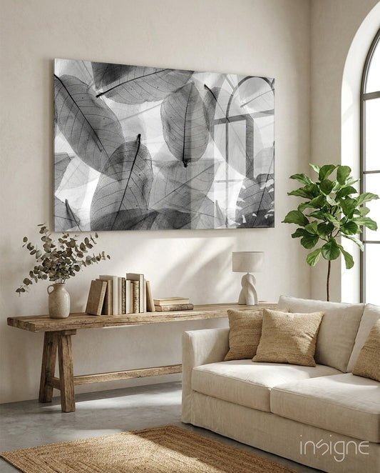 Black and White Leaves glass wall art displayed above a console in a designer interior