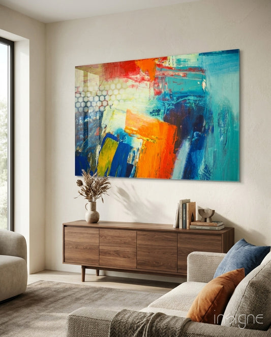 Abstract vibrant glass wall art displayed above a console in a designer interior