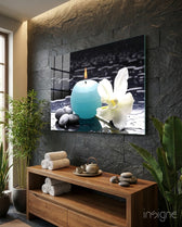 Candle zen glass wall art displayed above a console in a designer interior