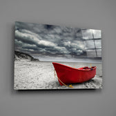 Close-up detail of the scarlet wooden boat against gray sand and sky