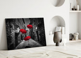 Red Umbrellas glass wall art styled above a sofa in a literary living room