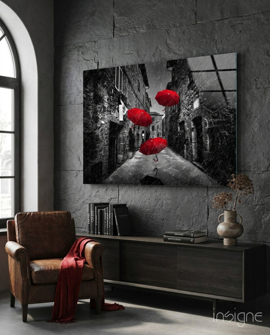 Red Umbrellas glass wall art displayed above a console in a designer interior