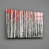 Close-up detail of birch trunks with red canopy selective color
