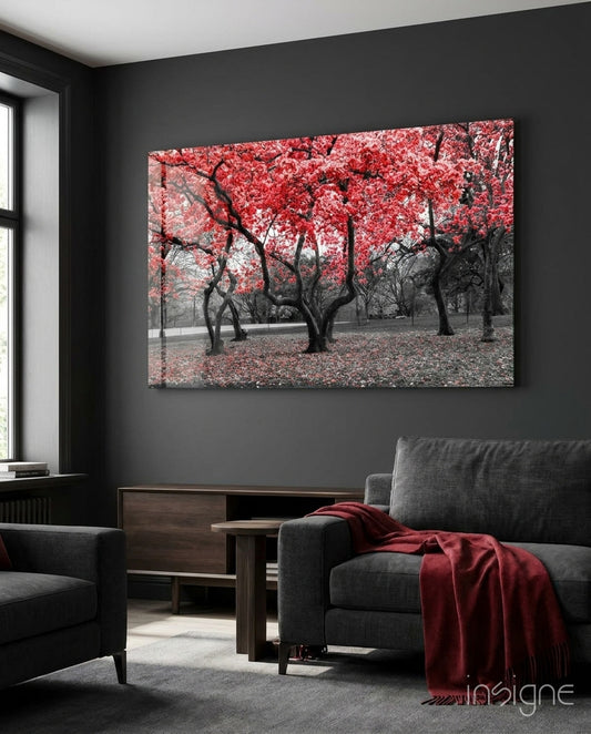 Red Tree blossom grove glass wall art displayed above a console in a designer interior