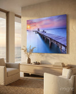Dock tropical sunset glass wall art displayed above a console in a designer interior