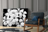 Flower artwork anchoring a dining area with elegant mood