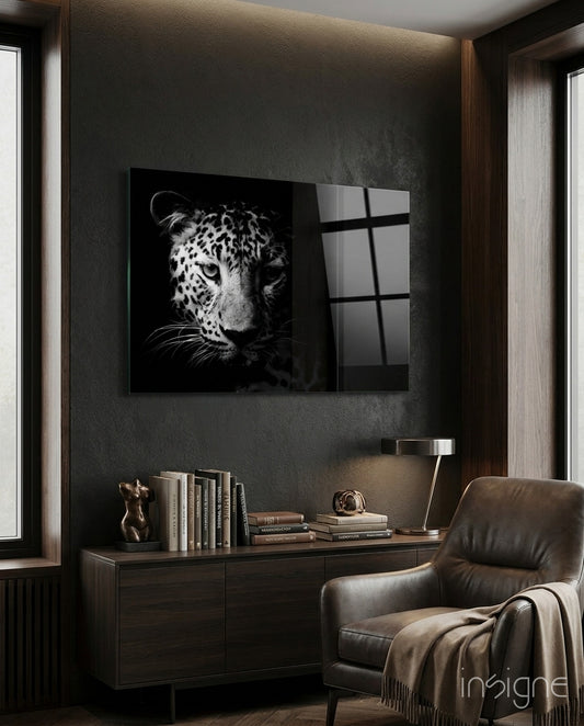 Leopard glass wall art displayed above a console in a designer interior