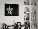 Flower glass print enhancing a bathroom with minimalist dark mood