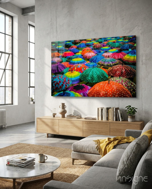 Colorful Umbrellas glass wall art displayed above a console in a designer interior