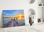 Dock glass wall art styled above a bed in a bright morning bedroom