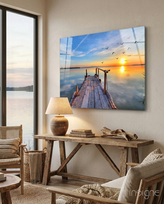 Dock sunrise glass wall art displayed above a console in a designer interior