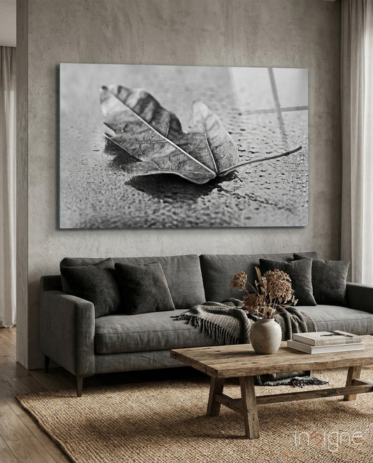 Leaf minimalist glass wall art displayed above a console in a designer interior
