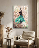 Female turquoise glass wall art displayed above a console in a designer interior