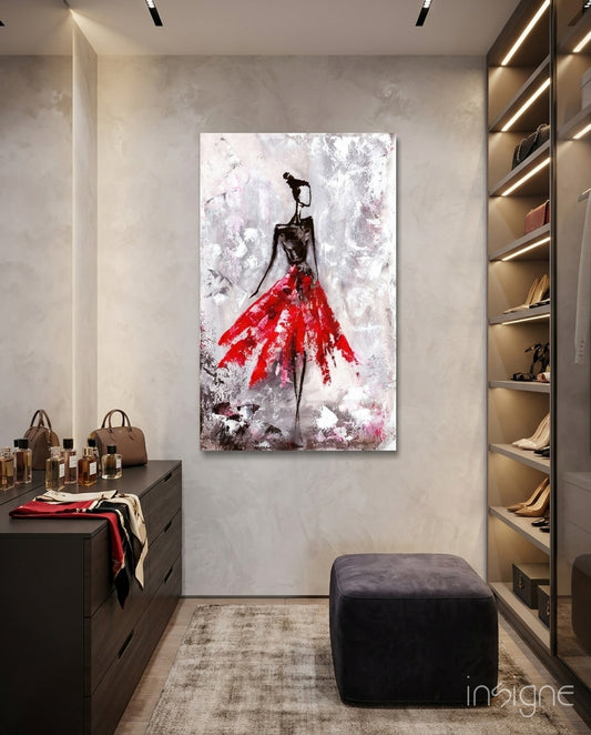 Female red glass wall art displayed above a console in a designer interior