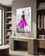 Woman pink glass wall art displayed above a console in a designer interior