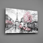 Close-up detail of pink blossoms over a Paris street with the Eiffel Tower