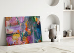 Abstract glass wall art styled above a sofa in a creative living room