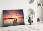 Dock glass wall art styled above a bed in a rich evening bedroom