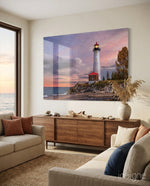 Lighthouse glass wall art displayed above a console in a designer interior