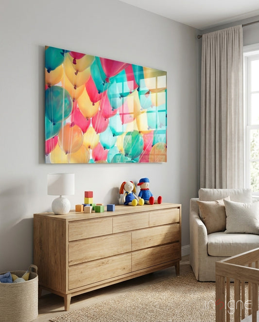 Balloons glass wall art displayed above a console in a designer interior