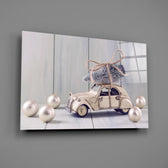 Close-up detail of the toy car with Christmas tree and pearl ornaments