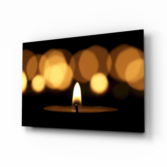 Candle glass wall art displayed above a console in a designer interior