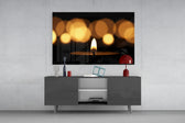 Candle panel catching warm light to reveal its bokeh glow