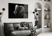 Elephant glass wall art styled above a sofa in a bold living room