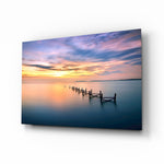 Sunset pier glass wall art displayed above a console in a designer interior