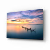 Sunset pier glass wall art displayed above a console in a designer interior