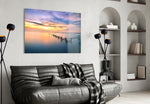 Sunset glass wall art styled above a bed in a poetic bedroom