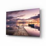 Dock twilight boat glass wall art displayed above a console in a designer interior