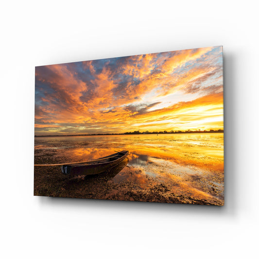 Lake amber sunset glass wall art displayed above a console in a designer interior