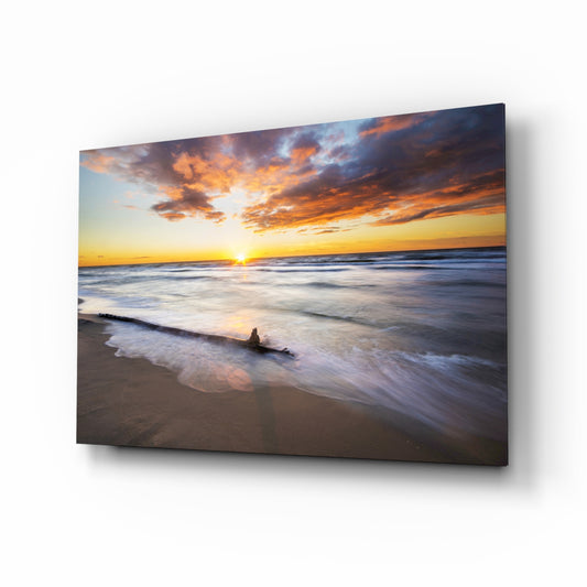 Sunset beach glass wall art displayed above a console in a designer interior