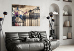 Birdcage glass wall art styled above a sofa in a literary-mood reading nook