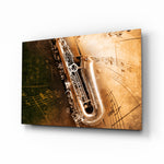 Saxophone glass wall art displayed above a console in a designer interior