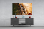 Saxophone panel catching warm light to reveal its brass shine